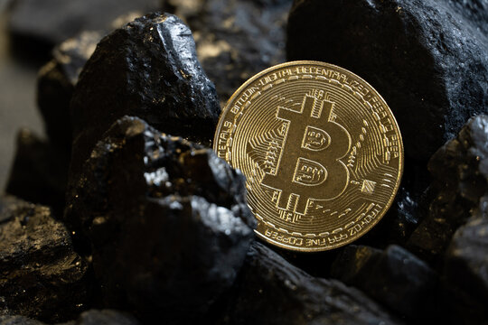 Gold coin bitcon and coal.