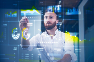 Businessman working on digital display at office