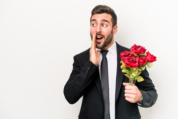 Young caucasian man holding a bouquet of flowers isolated on white background is saying a secret hot braking news and looking aside