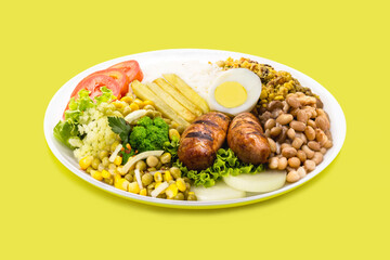 typical brazilian meal, rice and beans, tomato salad, boiled egg and french fries, called a traditional dish or executive dish