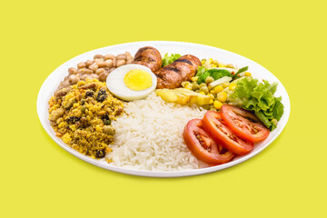 typical brazilian meal, rice and beans, tomato salad, boiled egg and french fries, called a traditional dish or executive dish
