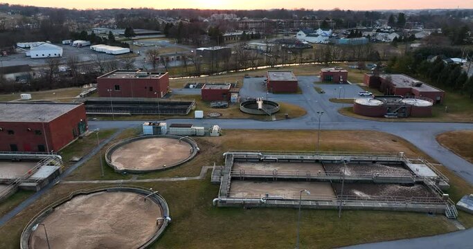 Sewage water treatment facility. Aerial of plant in American town. Clean drinking water safety quality contamination. Lead free, water chlorination theme.