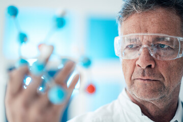 Scientist analyzing molecular structure with protective eyewear