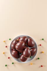 delicious chocolate easter eggs on cream color background.  flat lay. top view. happy easter day concept. 3D illustration