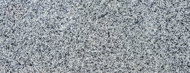 Close up seamless texture of gray granite background.