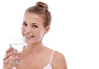 Its her beauty secret. A cute young girl with perfect skin drinking water while isolated on white.