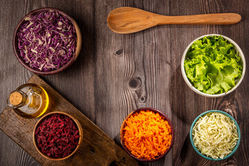 Fresh grated vegetables in bowls on the table. Healthy food.