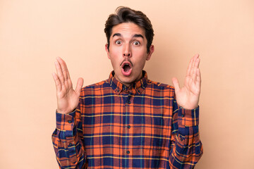 Young caucasian man isolated on beige background having an idea, inspiration concept.