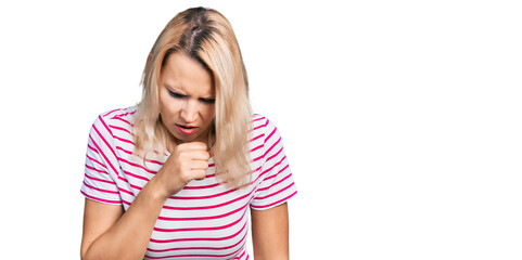 Young caucasian woman wearing casual clothes feeling unwell and coughing as symptom for cold or bronchitis. health care concept.