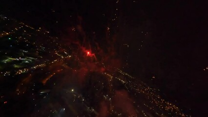 Exploding fireworks on Dominican Republic Independence Day, FPV drone view