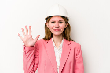 Young architect English woman with helmet isolated on white background smiling cheerful showing number five with fingers.