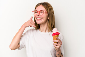 Young English woman holding an ice cream isolated on white background showing a mobile phone call gesture with fingers.