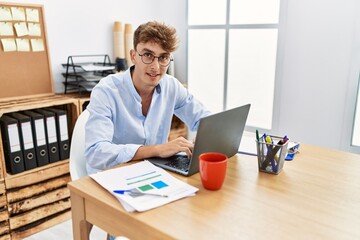 Young caucasian man smiling confident working at office