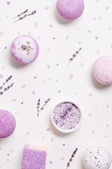 Obraz na płótnie Canvas Natural bath bombs and sea salt with lavender essential oil, spa products with dry herbal ingredients. Natural cosmetic for beauty treatment and body care, herbal medicine