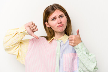 Young russian woman isolated on white background showing thumbs up and thumbs down, difficult...