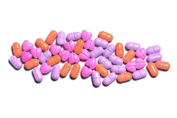Obraz na płótnie Canvas Closeup shot of a pile of colorful pills on white background.