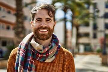 Young caucasian man with beard outdoors on a sunny day