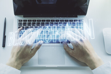Creative abstract blockchain technology sketch and hands typing on computer keyboard on background, future technology and blockchain concept. Double exposure