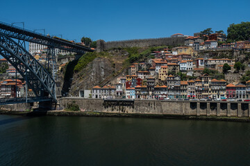 Fototapeta na wymiar Porto, Portugal: the ancient Fernandina wall between the funicular dos Guindais and the Dom Luiz bridge.