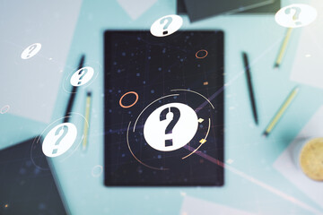 Creative abstract question mark hologram and modern digital tablet on desktop on background, top view, future technology concept. Multi exposure