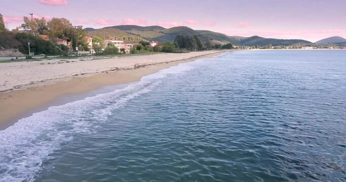 Idyllic aerial video of the sandy Toroni beach on the Sithonia peninsula in the Halkidiki region of Greece. Recreation and tourism concept
