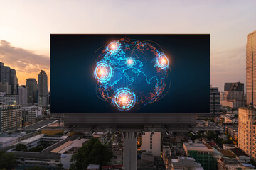 Glowing hologram of Earth planet map on billboard over aerial panoramic cityscape of Bangkok at...