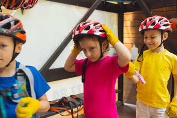 The kids are examining their equipment before start the adventure