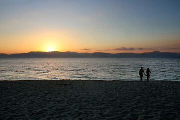 A couple of tourists at Moalboal White Beach in Cebu, Philippines.