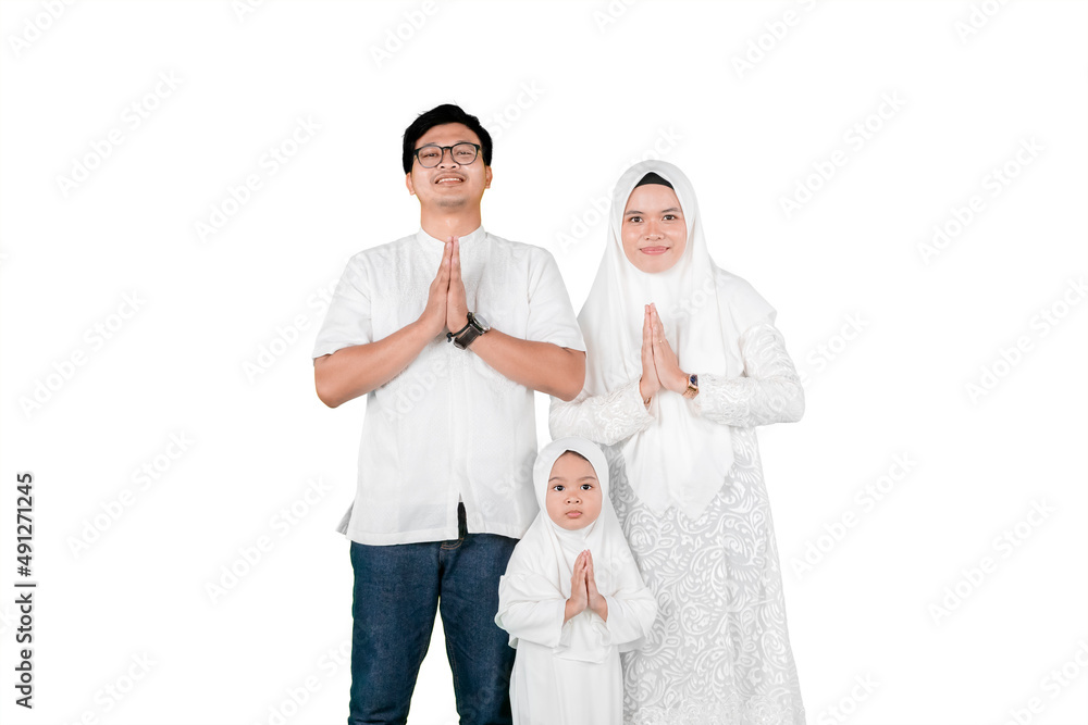 Wall mural young muslim family shows a greeting hands