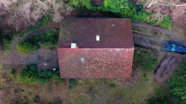 Vertical downward flight to inspect the condition of the roof of a single-family house