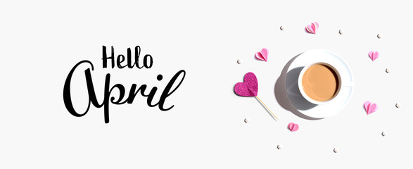 Hello April message with a cup of coffee and paper hearts - flat lay