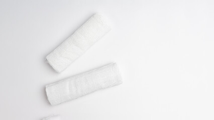 two rolls of white bandage isolated on white background