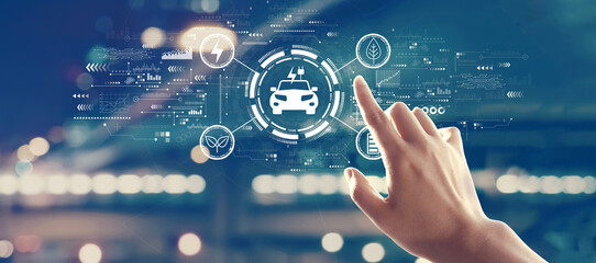 EV concept with hand pressing a button on a technology screen