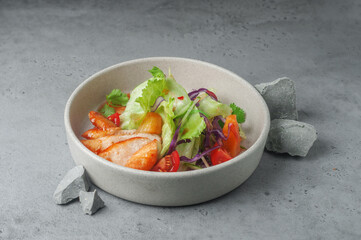 vegetable salad with fried chicken on gray background 