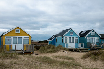 Fototapeta na wymiar beach huts at Mudeford Spit England