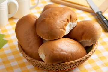 Traditional fresh Dutch white soft buns in a basket close up 