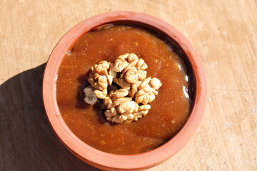 Dessert from grape juice in an earthen bowl, Local name is 