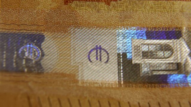 Verification of the 50 euro banknote for authenticity. Close-up of the watermark with the image of Europe on the new 50 euro banknote.
