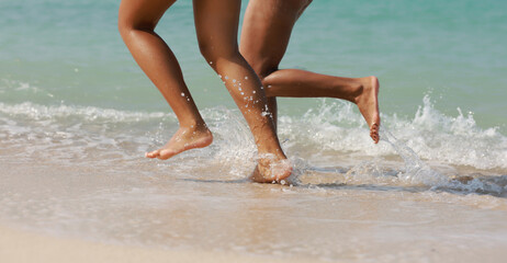 Close up female tourist's lag running on beach , enjoy women run along beach