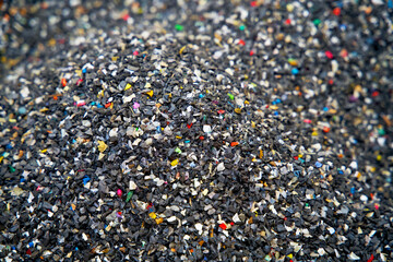 Close up of granulated plastic waste on a recycling plant for plastics