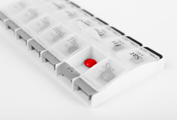 Pills case with vitamins or tablets. Reminder and organizer for daily taking pills. Health care concept. High quality photo