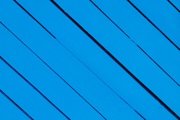 Wooden background painted with blue paint