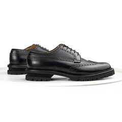Black brogue derby on a white background
