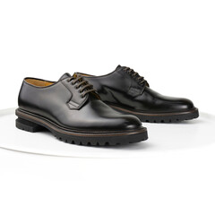 Brown leather derby shoes on a white background