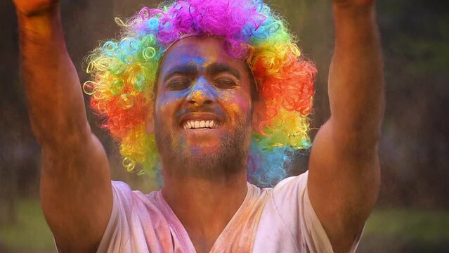 Happy young Boy on holi color festival Colored powder explosion.