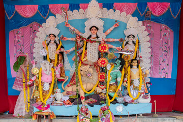 Goddess Durga idol at decorated Durga Puja pandal, at Kolkata, West Bengal, India. Durga Puja is...