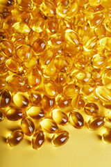 Golden Vitamin D3 Capsules close-up in full screen
