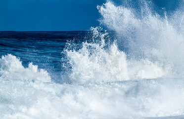 Splashing Ocean wave on the beach - 491296425