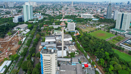 Aerial view of TVRI tower surrounded by buildings. TVRI is a state-owned television network in Indonesia. Jakarta, Indonesia, March 8, 2022