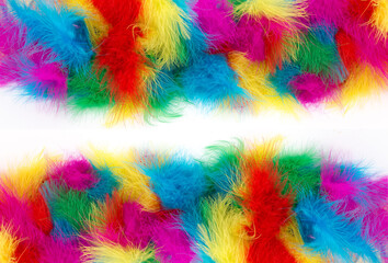 Multicolored bright birds, colorful feathers as a bright festive fun background with space for text for design for design plumage frame